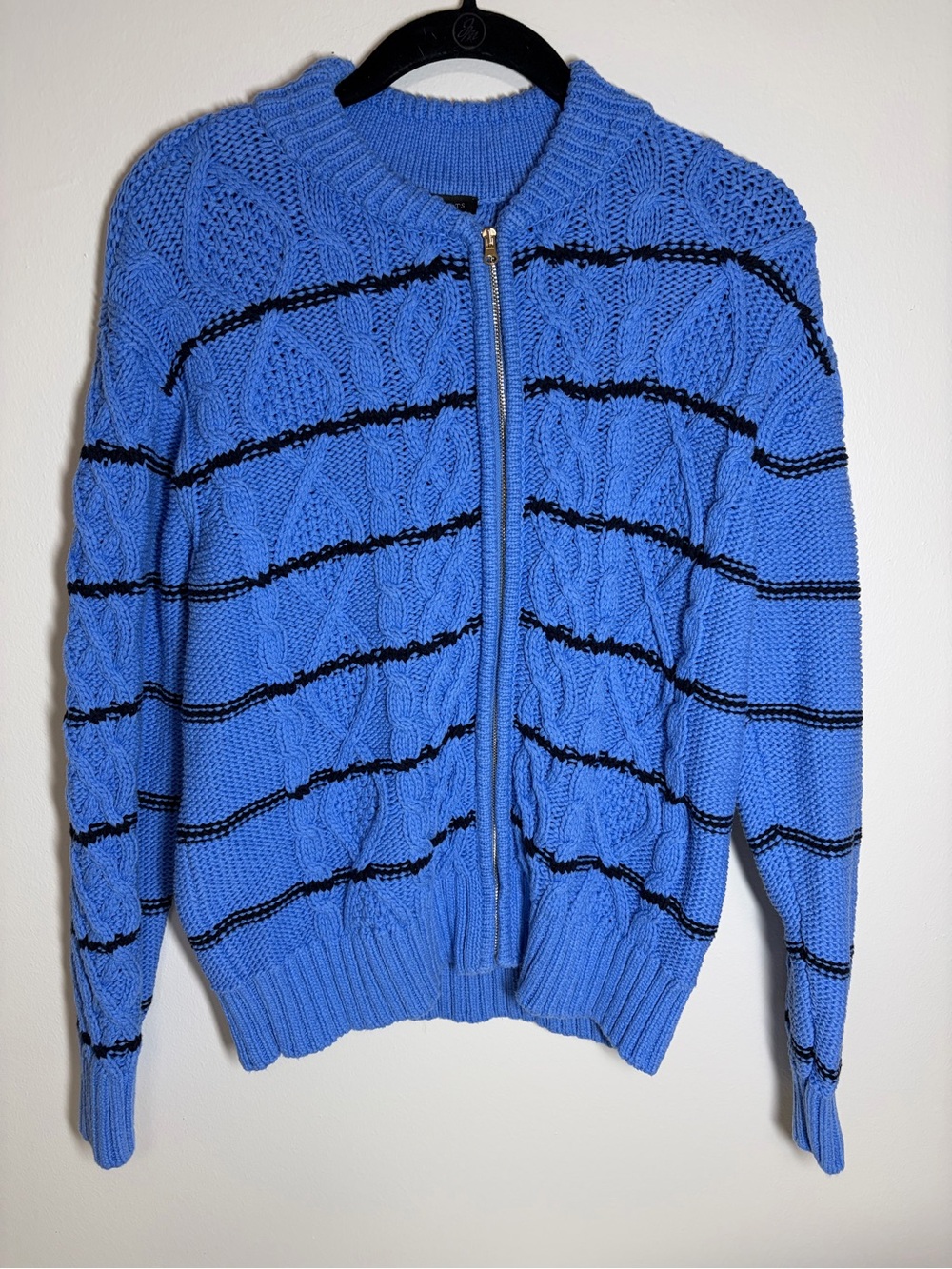 Woman’s Blue Chunky Cable-Knit Zip Sweater with Black Stripes.